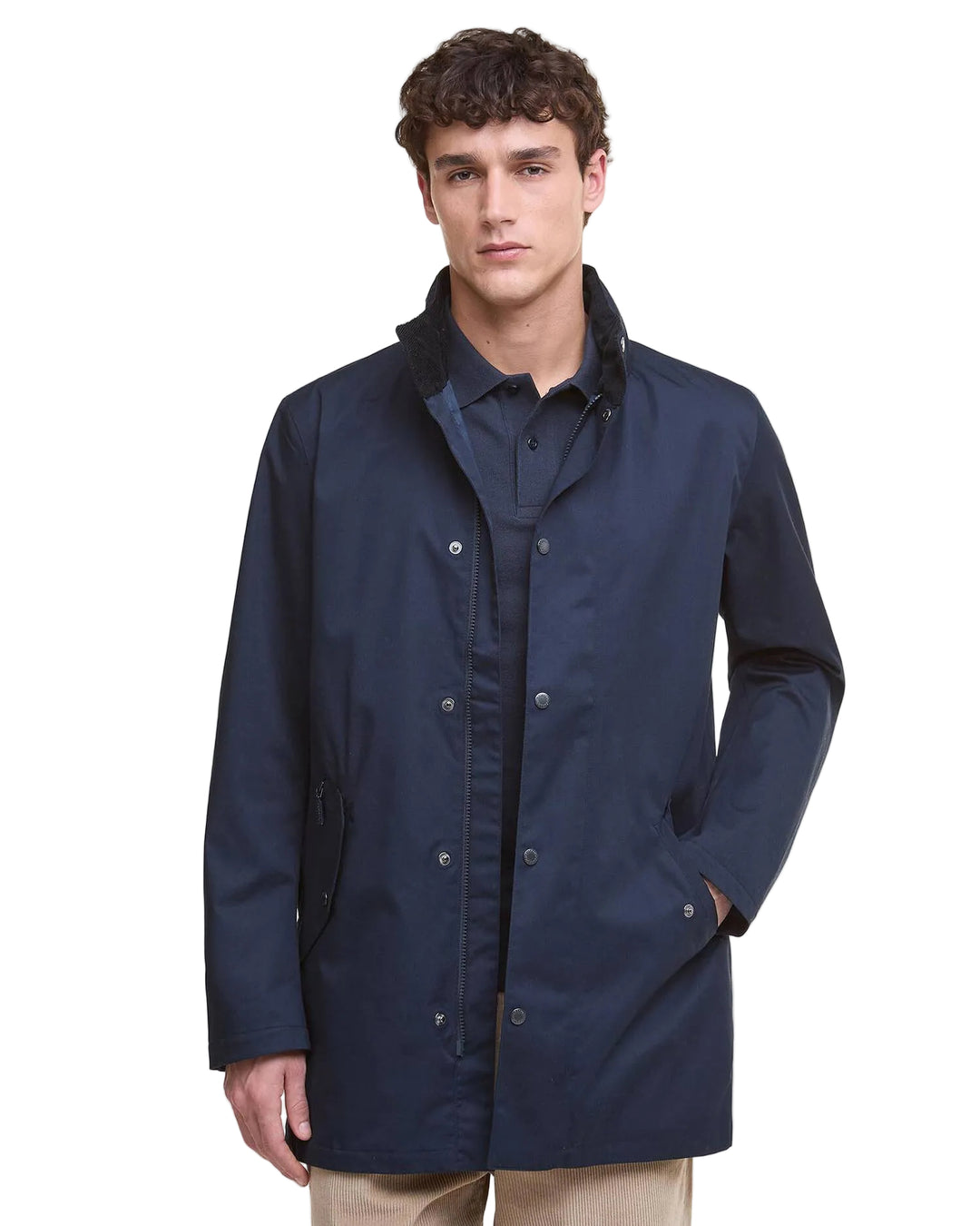 Man wearing a navy blue raincoat 